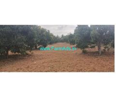5.15 Acres yielding mango plantation with house for sale near Kunigal